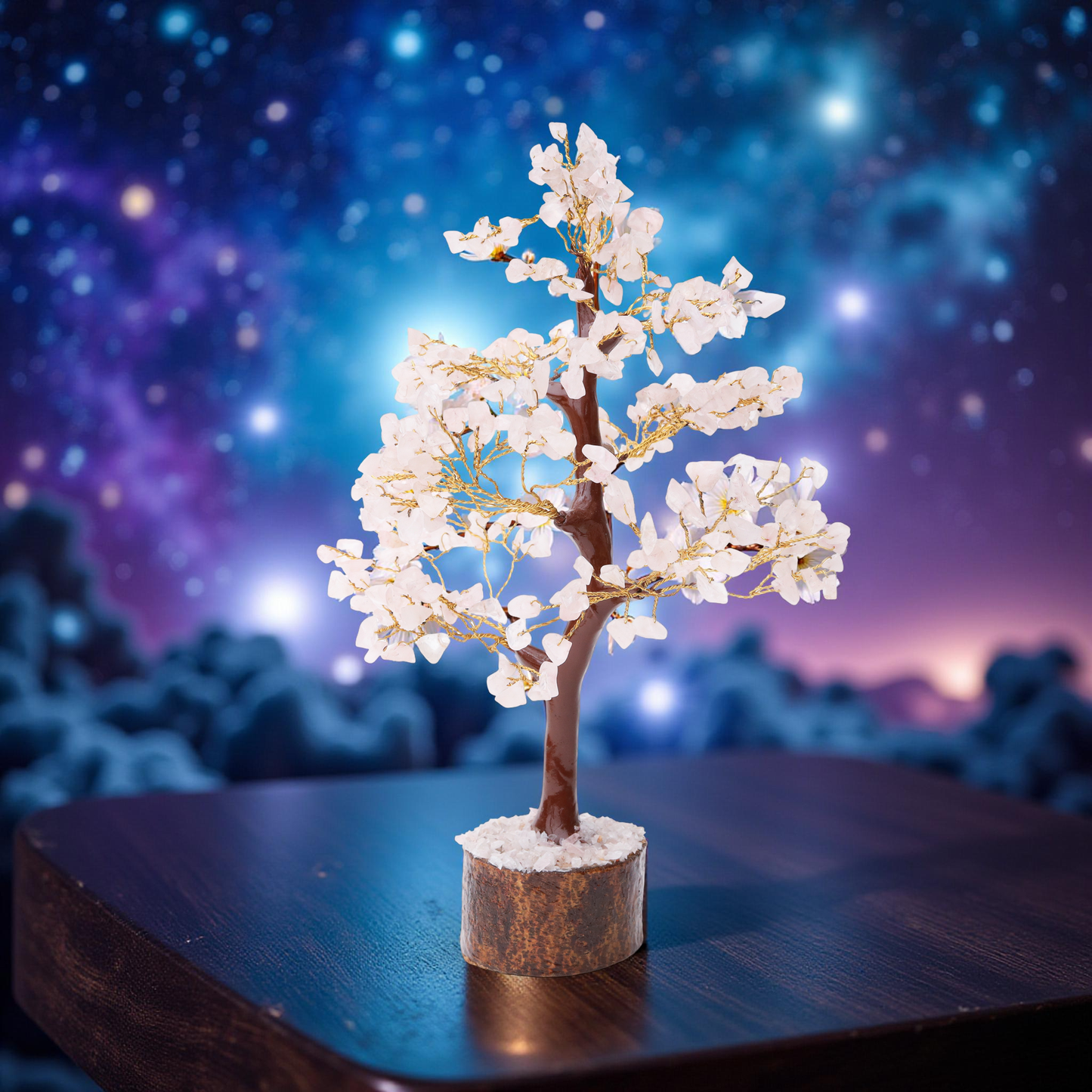 AstroViz Rose Quartz crystal tree with soft white gemstone chips displayed against a deep blu