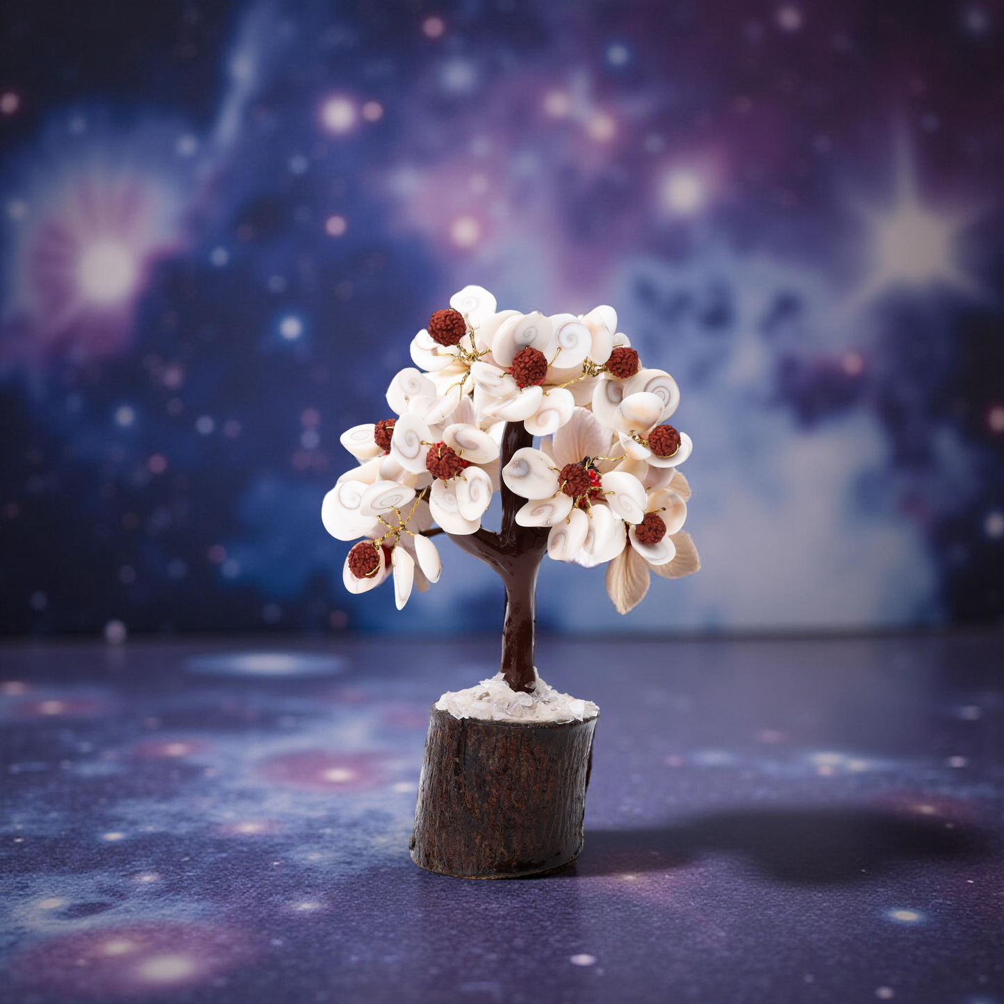 Natural cowrie shell and rudraksha decorative tree with crystal chip base
