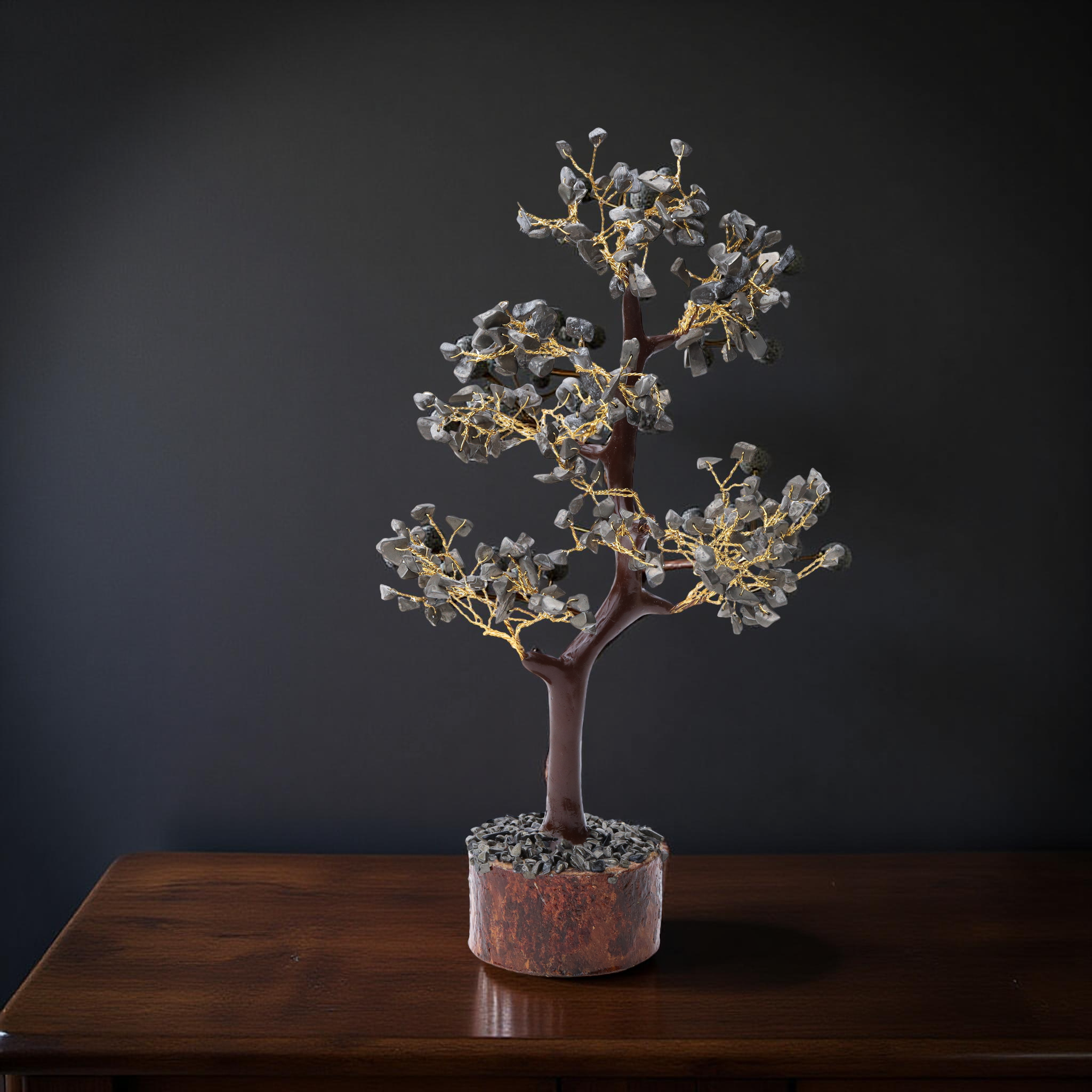AstroViz Labradorite gemstone crystal tree with blue-grey stone chips on gold wire displayed on a dark wooden table against a deep charcoal background
--3