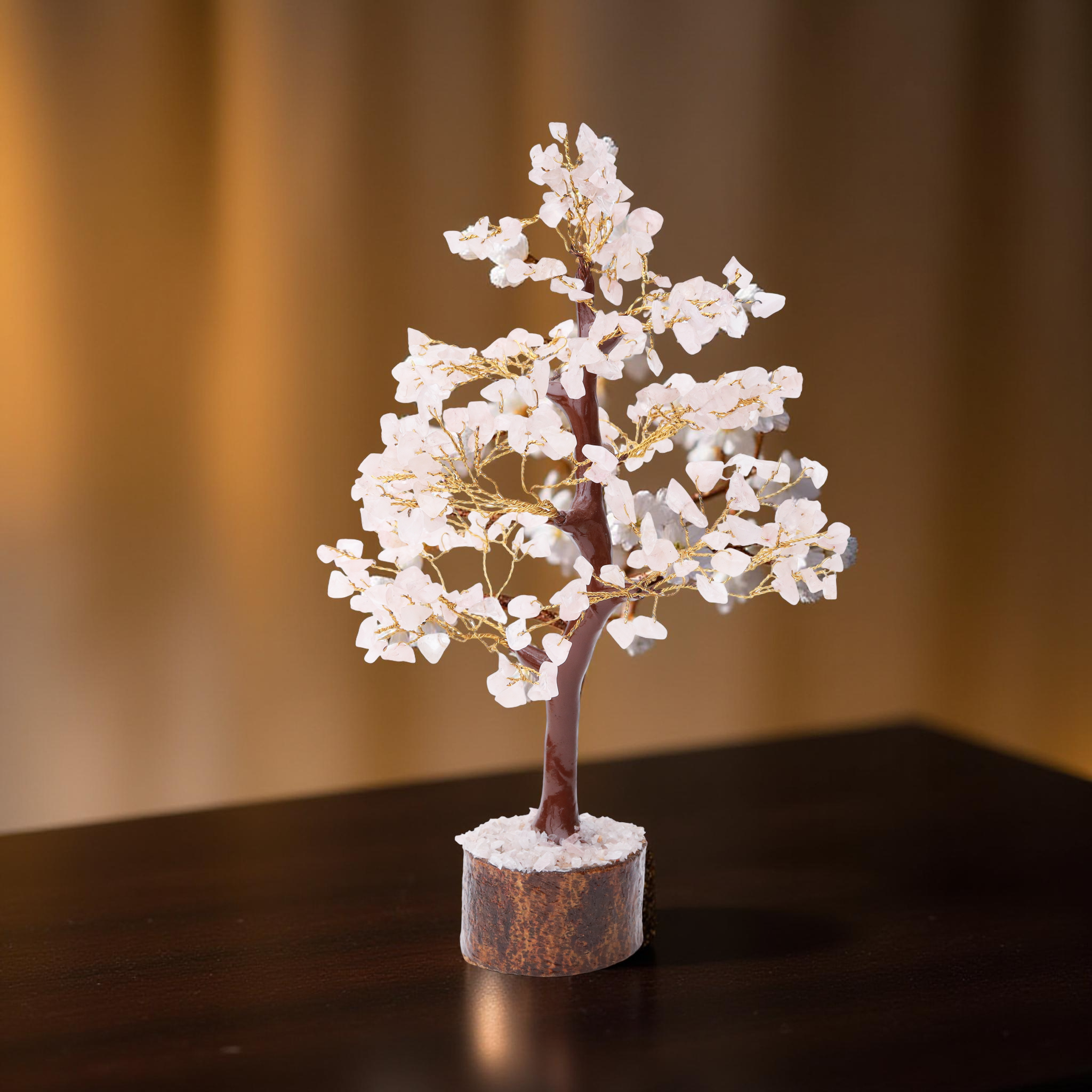 AstroViz Rose Quartz gemstone crystal tree with soft white pale pink stone chips on gold wire displayed against a warm beige background with natural shadow
--4