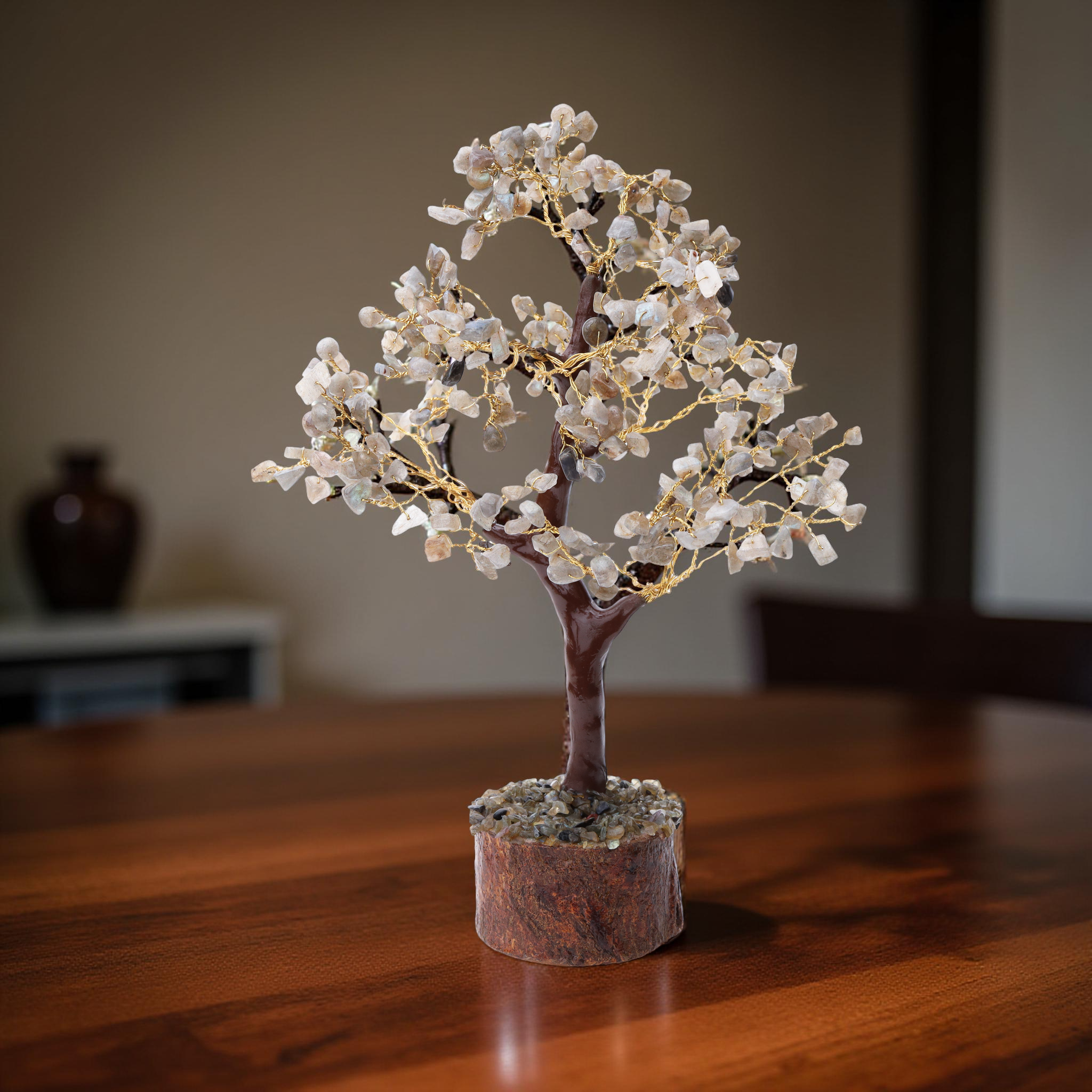Clear quartz wish tree with gold wire branches on natural wood log base
--3