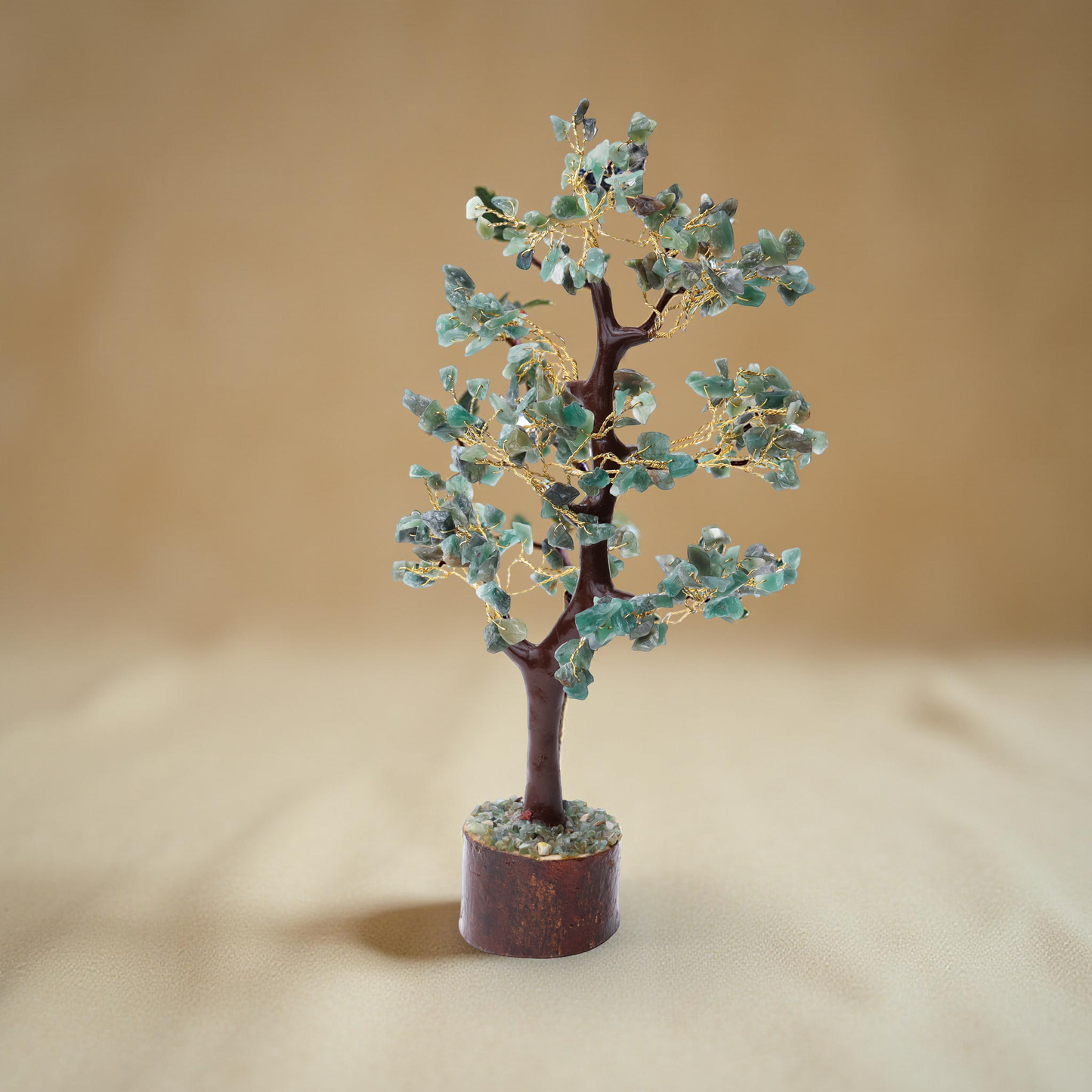 AstroViz Green Aventurine gemstone crystal tree with soft mint green stone chips on gold wire displayed against a warm beige background

