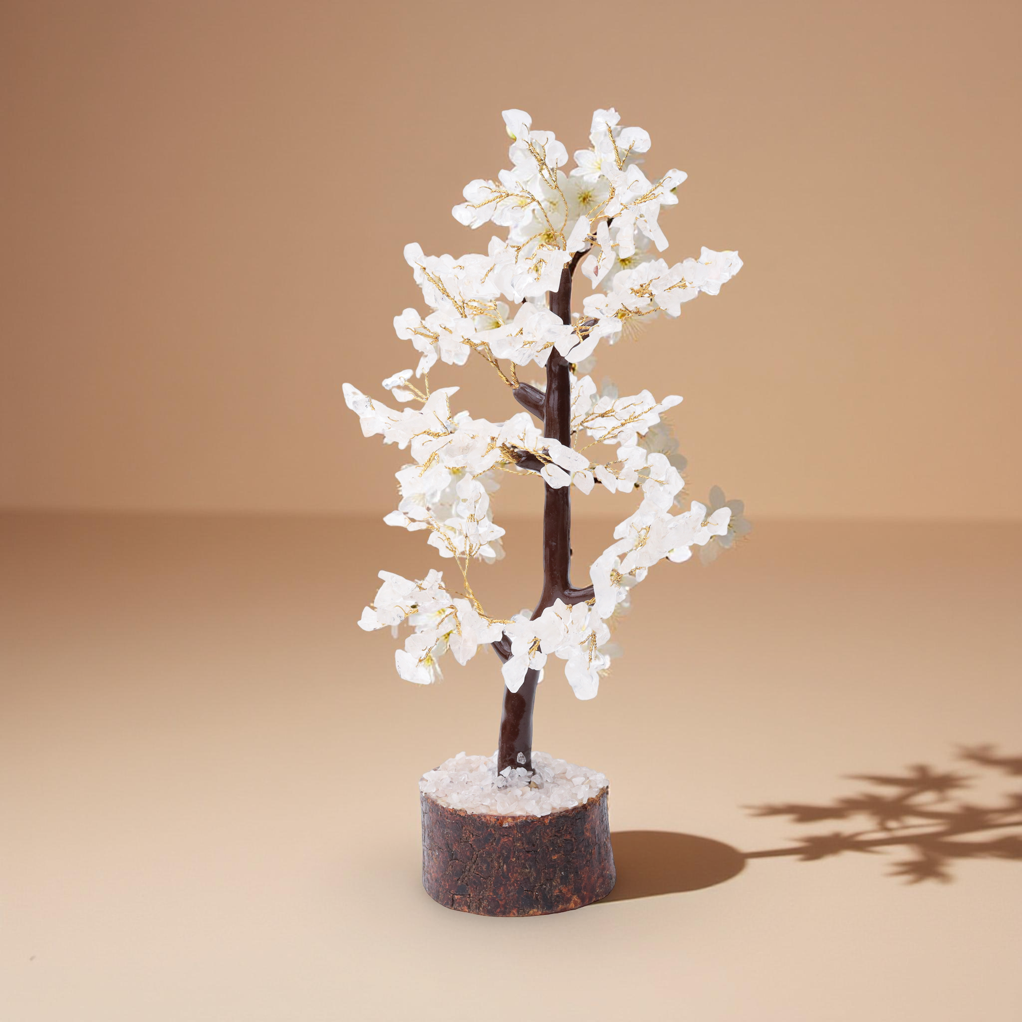 AstroViz white moonstone blossom tree with floral-rosette engraved chip details and gold wire open branches on coarse crystal chip dark bark wood base warm beige background--5