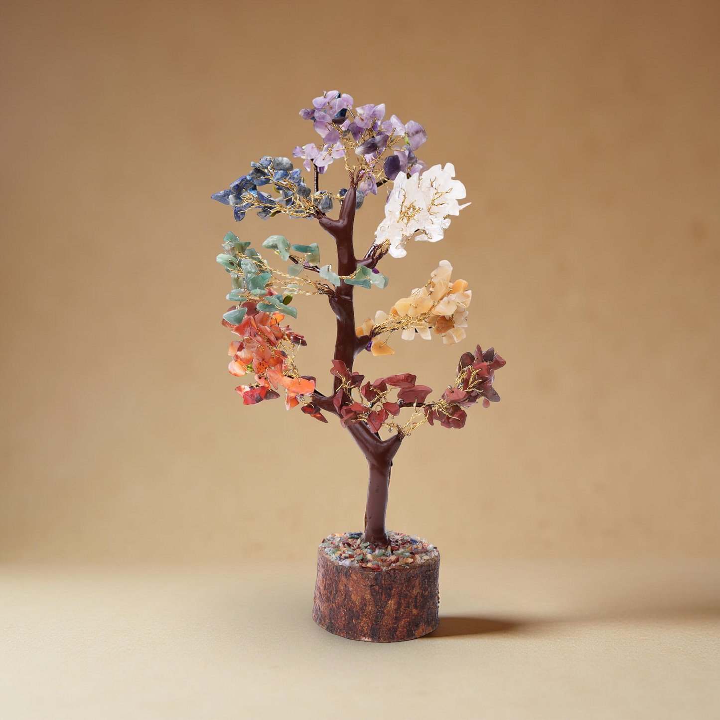 Handcrafted chakra crystal tree with gold-tone branches and a natural wood-style base.