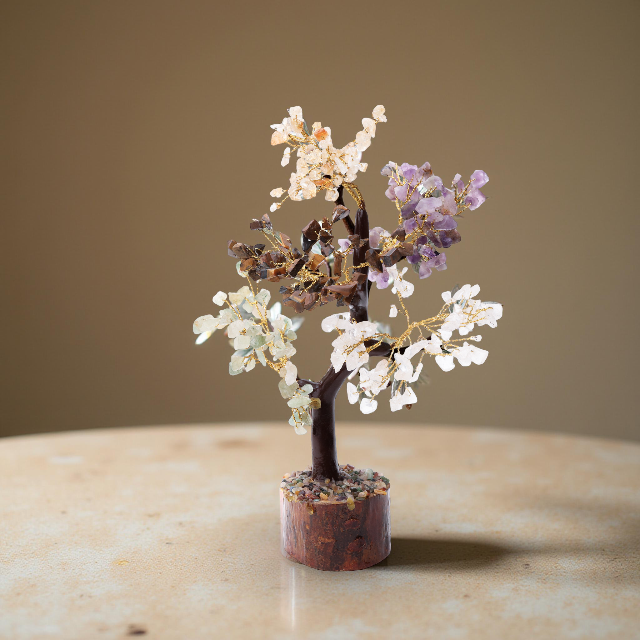 AstroViz four gemstone chip decorative tree on vivid reddish-brown bark wood stump base displayed on warm beige marble side table--3