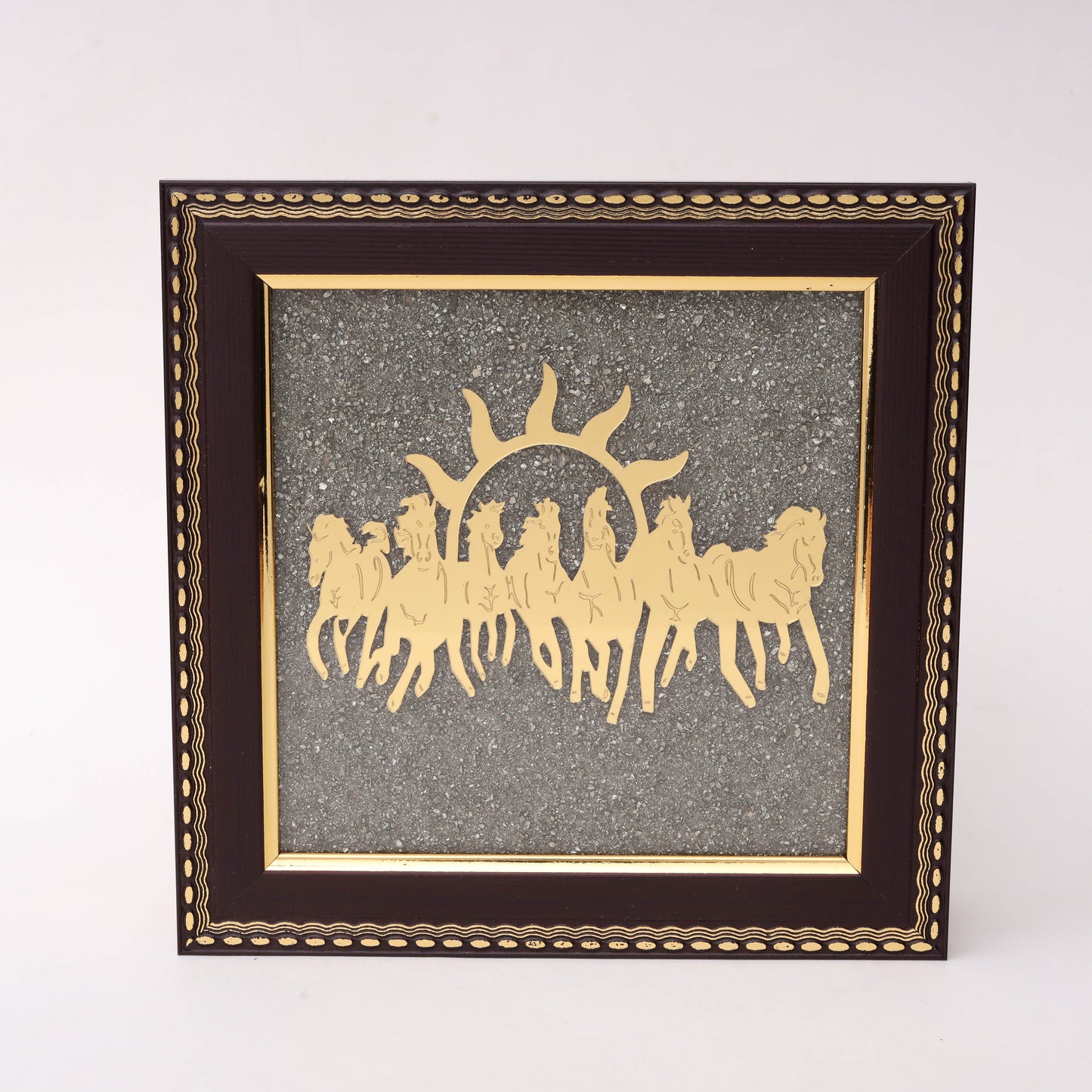 Gold-tone sun and running horses wall art in decorative wooden frame with textured background
