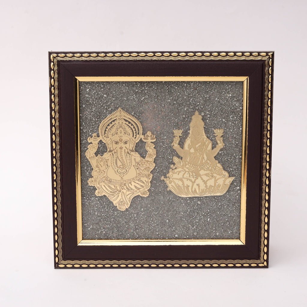 Gold-tone Ganesha and Lakshmi wall art in decorative wooden frame with textured background