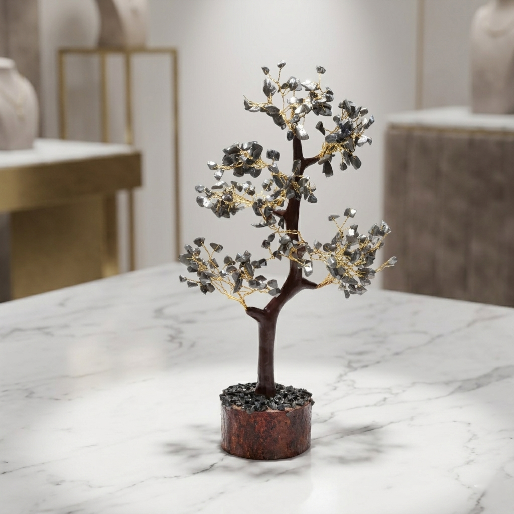 Grey labradorite crystal chip tree with gold wire on rustic wooden log base
